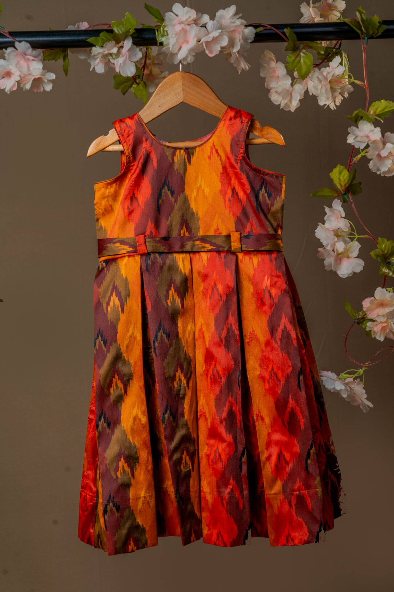 Vibrant Autumn Ikat Print Girl's Dress with Fixed Waist Belt and Pleated Skirt - Image 3