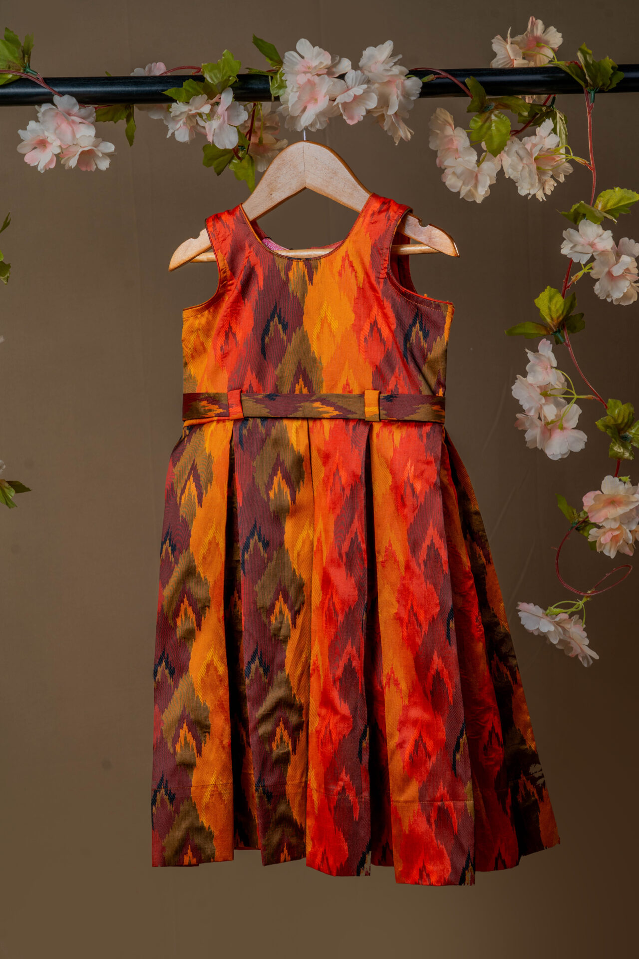 Vibrant Autumn Ikat Print Girl's Dress with Fixed Waist Belt and Pleated Skirt - Image 4