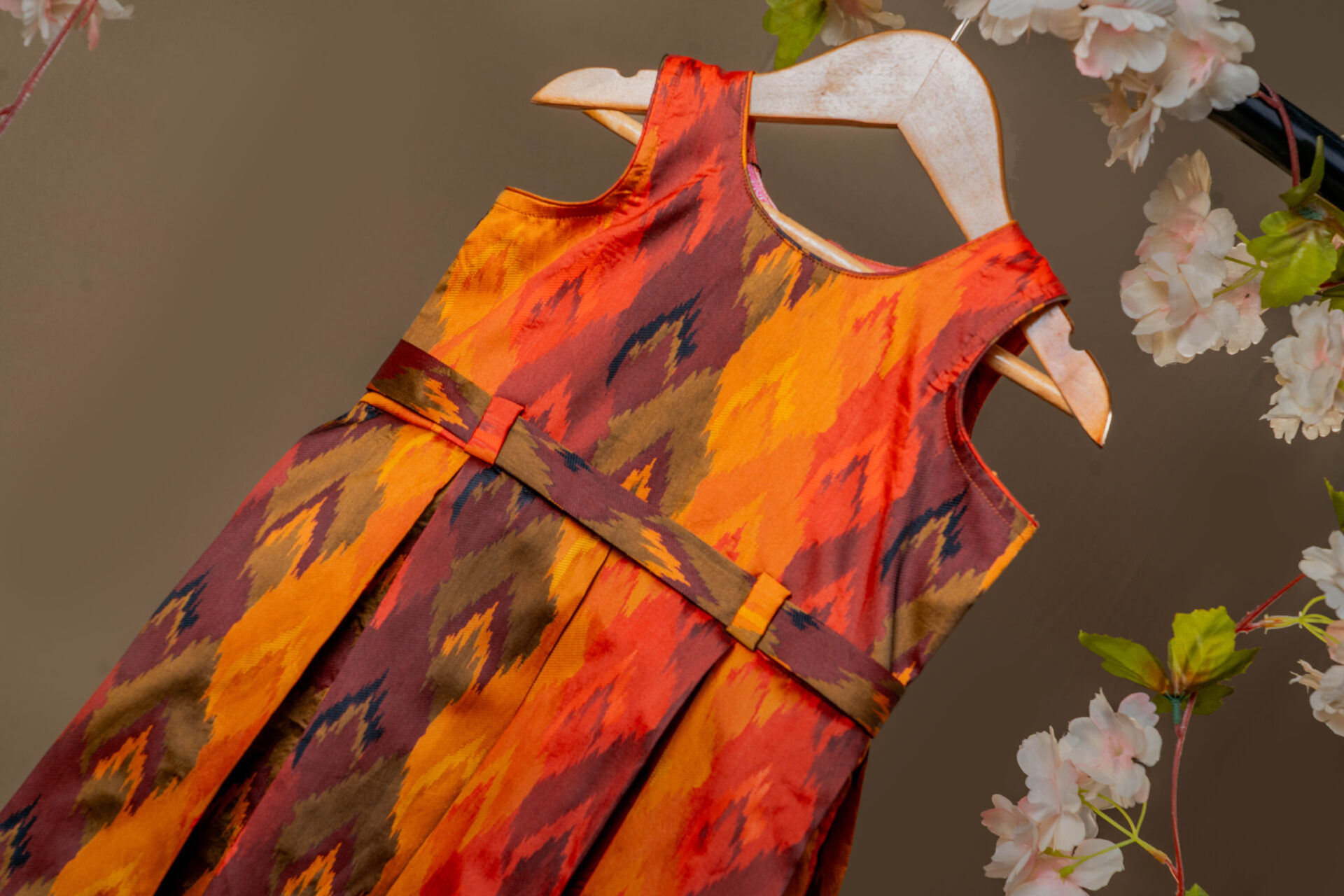 Vibrant Autumn Ikat Print Girl's Dress with Fixed Waist Belt and Pleated Skirt